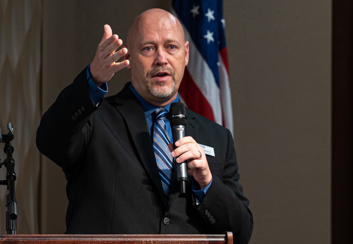 Chris Lawson, an education services specialist with 88th Force Support Squadron, addresses attendees during an education fair at Wright-Patterson Air Force Base, Ohio, July 24, 2024.