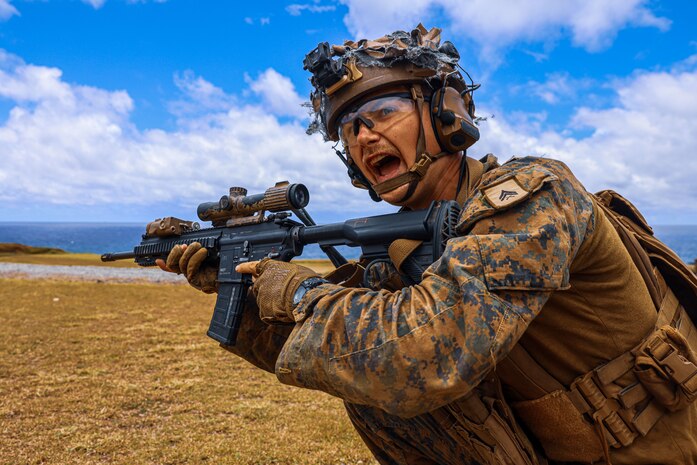 U.S. Marine Corps Cpl. Michael Chupurdia, a team leader assigned to Light Armored Reconnaissance Company, Battalion Landing Team 1/5, 15th Marine Expeditionary Unit, directs his fire team during live-fire squad attacks at Marine Corps Base Hawaii July 20, 2024. Squad level live-fire training enhances combat readiness and maintains the proficiency of the Marine Corps rifle squad. (U.S. Marine Corps photo by Cpl. Aidan Hekker)