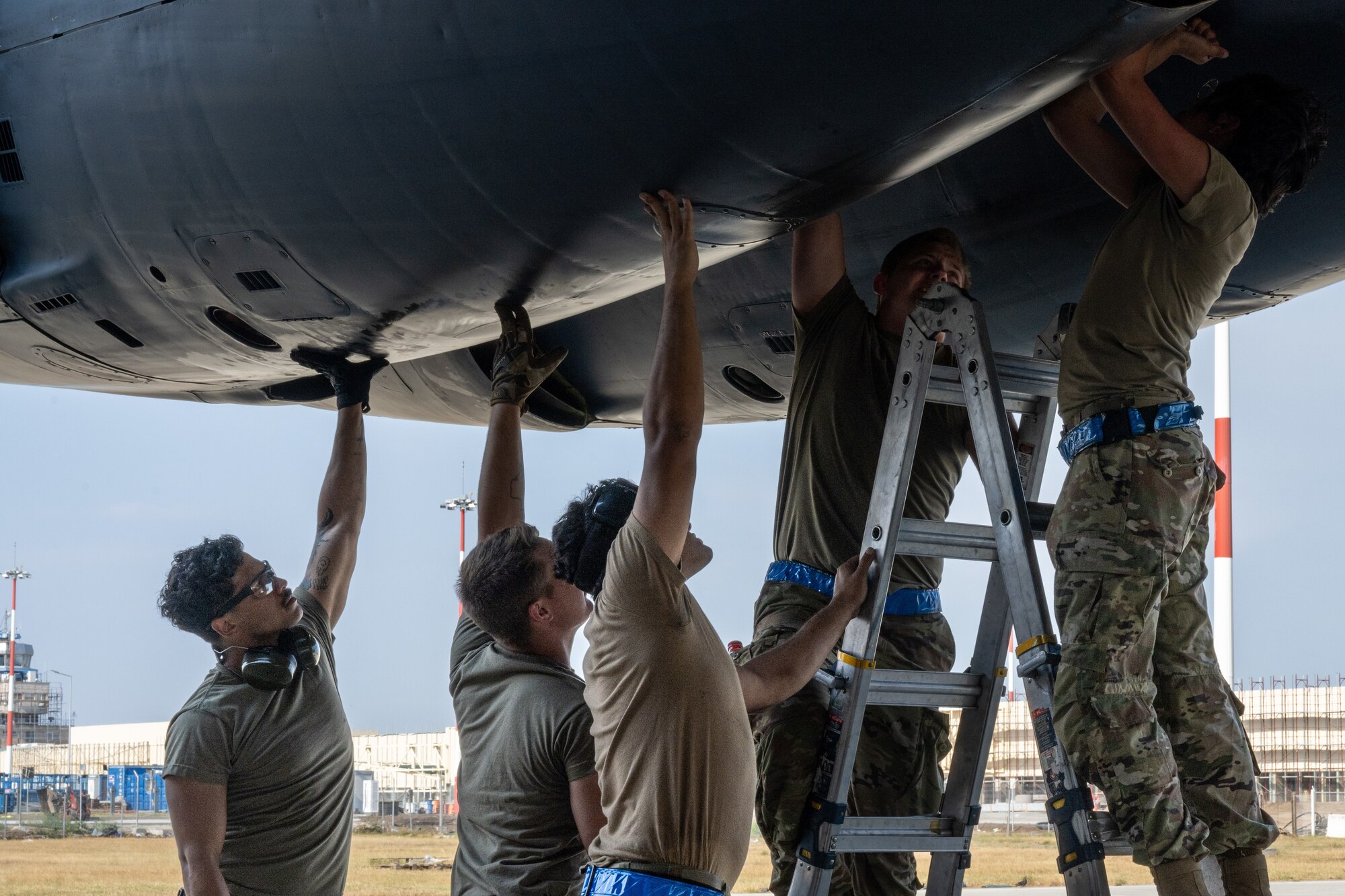 U.S. Air Force maintainers, deployed from Barksdale Air Force Base, La., prepare to open the engine cowling on a B-52H Stratofortress following its initial landing at Mihail Kogălniceanu Air Base, Romania, as part of Bomber Task Force Deployment 24-4, July 21, 2024.