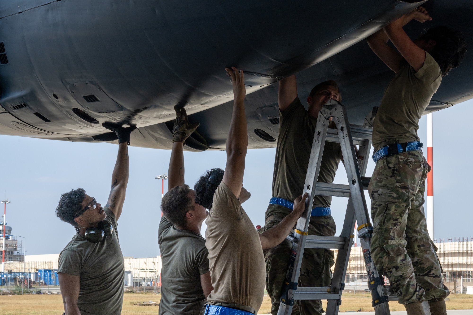 U.S. Air Force maintainers, deployed from Barksdale Air Force Base, La., prepare to open the engine cowling on a B-52H Stratofortress following its initial landing at Mihail Kogălniceanu Air Base, Romania, as part of Bomber Task Force Deployment 24-4, July 21, 2024.