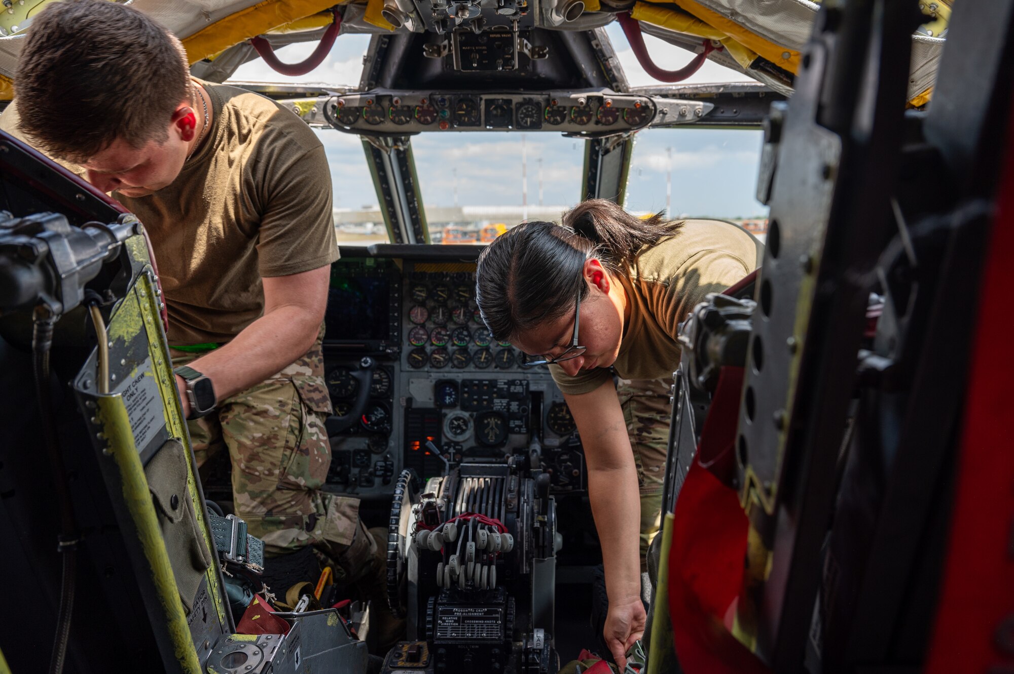 U.S. Air Force aircrew flight equipment specialists deployed from Barksdale Air Force Base, La., perform parachute inspections inside the cockpit of a B-52H Stratofortress at Mihail Kogălniceanu Air Base, Romania, during Bomber Task Force Deployment 24-4, July 22, 2024.