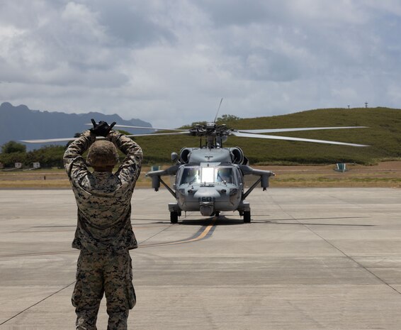 U.S. Marine Corps Cpl. Alexis S. Medina with Marine Wing Support Squadron 174, Marine Aircraft Group 24, 1st Marine Aircraft Wing taxis a MH-60S Sea Hawk attached to Helicopter Sea Combat Squadron 6 in support of Exercise Rim of the Pacific (RIMPAC) 2024 at Marine Corps Air Station Kaneohe Bay, Hawaii, July 16, 2024. Twenty-nine nations, 40 surface ships, three submarines, 14 national land forces, more than 150 aircraft and 25,000 personnel are participating in RIMPAC 2024 in and around the Hawaiian Islands, June 27 to Aug. 1. The world's largest international maritime exercise, RIMPAC provides a unique training opportunity while fostering and sustaining cooperative relationships among participants critical to ensuring the safety of sea lanes and security on the world's oceans. RIMPAC 2024 is the 29th exercise in the series that began in 1971. (U.S. Marine Corps photo by Cpl. Anabelle Reed-O’Brien)