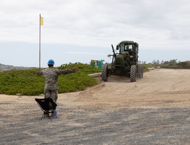 U.S. Marines with Marine Wing Support Squadron 174, Marine Aircraft Group 24, 1st Marine Aircraft Wing level out an area to create more space for parking at Pyramid Beach, Marine Corps Base Hawaii, July 16, 2024. The construction of the new parking area is underway to improve safety and quality of life at the Pyramid Beach access point. (U.S. Marine Corps photo by Cpl. Anabelle Reed-O’Brien)