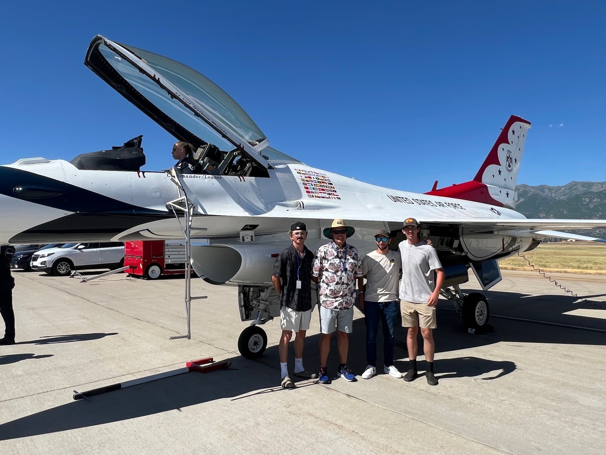 Braxton Hammond, Ken Hammond, Parker Atmore and Dylan Atmore pose in front of a Thunderbirds F-16 aircract.  Ken Hammond and Parker Atmore of the 532nd Commodities Maintenance Squadron were instrumental in helping the Thunderbirds acquire a needed part for repairs.  Without the part, the jet would've been unable to perform at the Hill Air Show. (Courtesy photo)