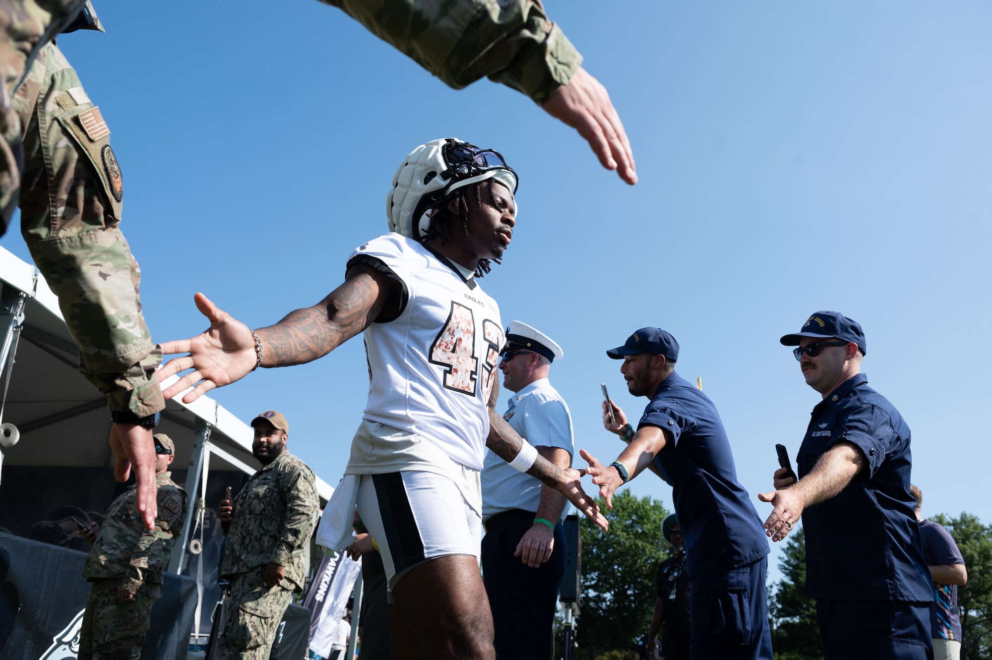 Mekhi Garner, Philadelphia Eagles cornerback, greets U.S. service members during The Eagles Training Camp at the Novacare Complex in Philadelphia, Pennsylvania, July 27, 2024. The event gave military members from all six branches the opportunity to watch the Eagles’ practice before the start of the 2024-2025 football season. (U.S. Air Force photo by Senior Airman Dieondiere Jefferies)