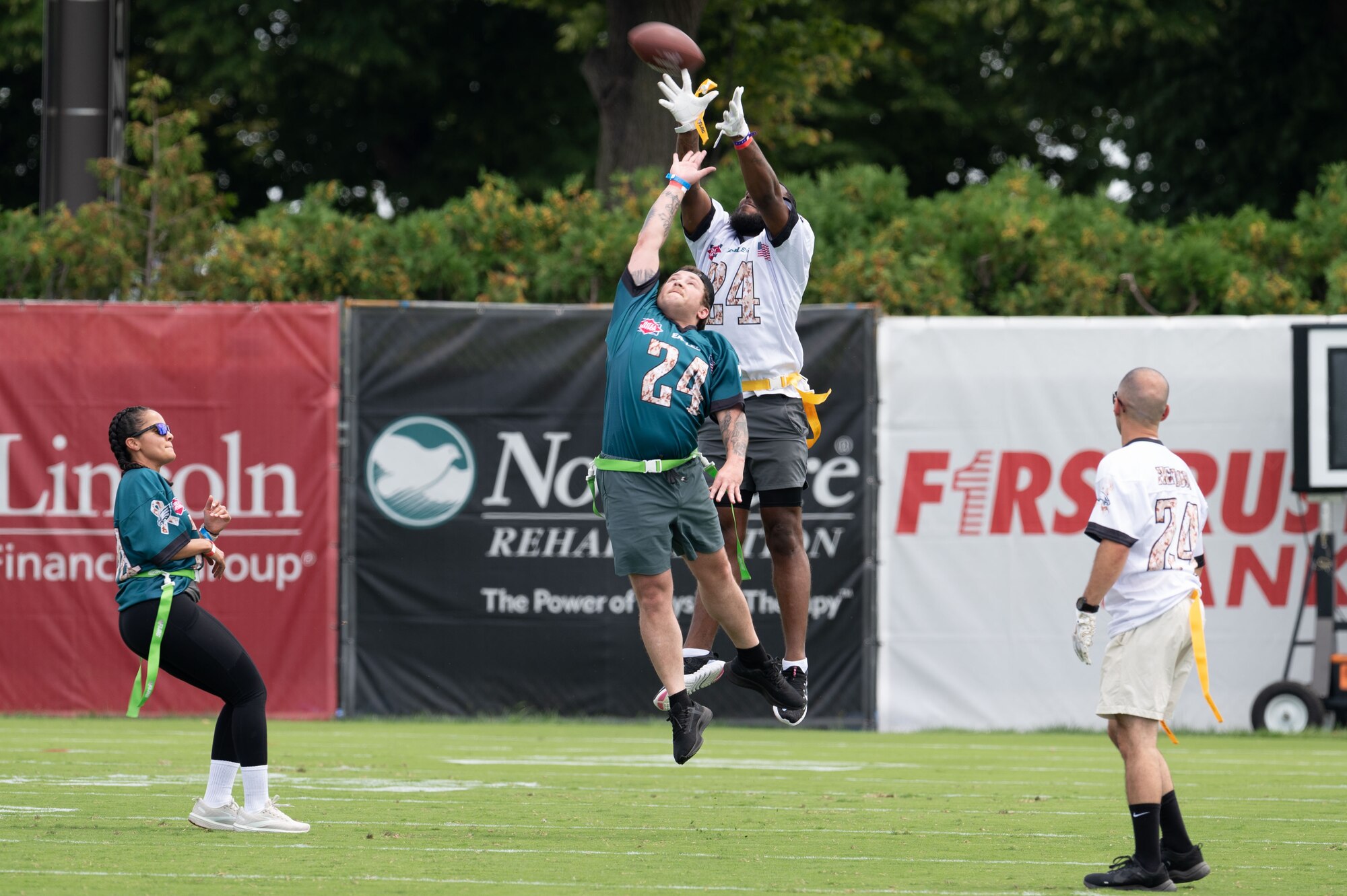 U.S. military members play flag football at the Novacare Complex in Philadelphia, Pennsylvania, July 27, 2024. The event gave U.S. service members from all six branches of the military the opportunity to watch the Eagles’ practice before the start of the 2024-2025 football season. (U.S. Air Force photo by Senior Airman Dieondiere Jefferies)