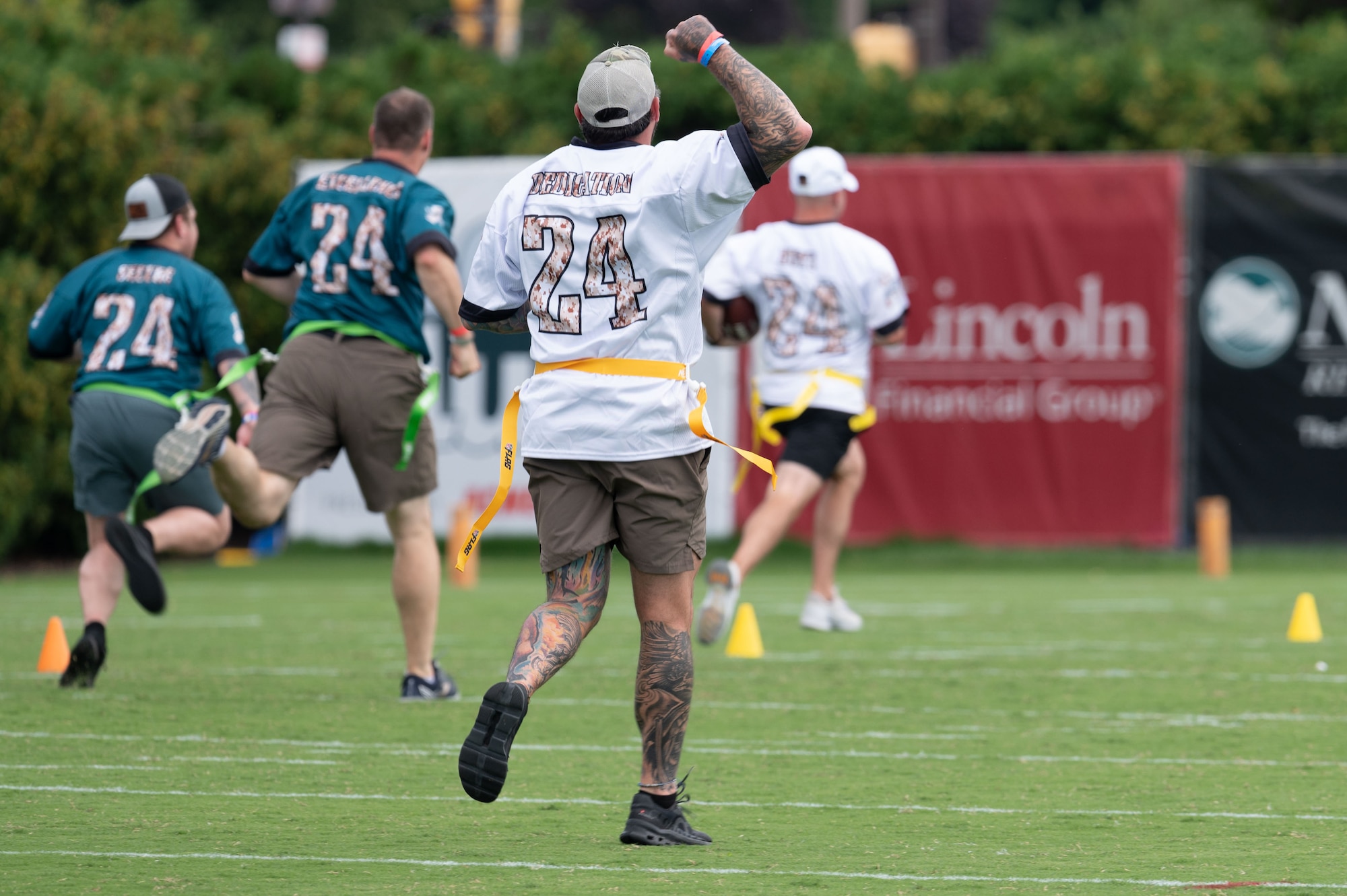 A U.S. service member cheers on his teammate during a flag football game at the Novacare Complex in Philadelphia, Pennsylvania, July 27, 2024. The event gave military members from all six branches the opportunity to watch the Eagles practice before the start of the 2024-2025 football season. (U.S. Air Force photo by Senior Airman Dieondiere Jefferies)