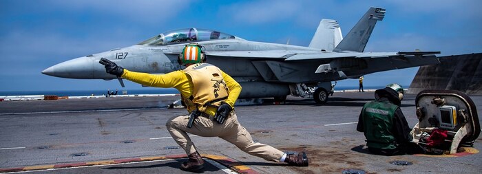 An F/A-18F Super Hornet from the "Flying Eagles" of Strike Fighter Squadron (VFA) 122 launches from the flight deck of the aircraft carrier USS Nimitz (CVN 68) in the Pacific Ocean, July 26, 2024.