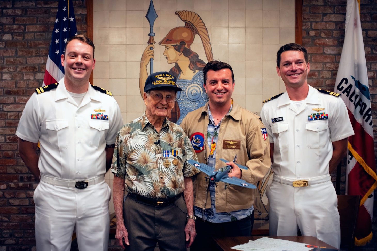 (Right to Left) Lt. Cmdr. Brantley Harvey, Naval Aviator and executive officer of Navy Reserve Center Sacramento, George Retelas, Richard E. Miralles and a U.S. Navy Lt. pose for a photo after an award ceremony honoring Miralles at the California State Capitol Building, July 25, 2024.