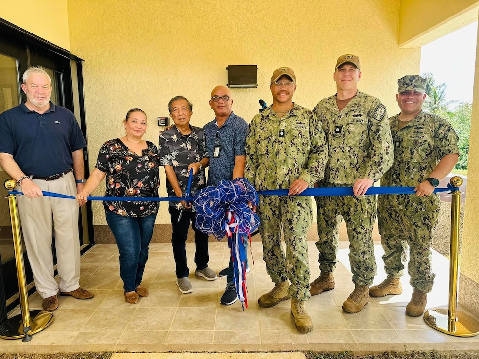 NAVAL BASE GUAM (May 17, 2024) – U.S. Naval Base Guam (NBG) Unaccompanied Housing staff held a ribbon cutting at Bachelor Enlisted Quarters (BEQ) B-582 in Camp Covington, May 17. Pictured cutting the ceremonial ribbon from left-to-right: Joint Region Marianas (JRM) Housing Director Paul Hazlerig, JRM Housing Program Manager Bernie Aquiningoc, former NBG Unaccompanied Housing (UH) Engineer Romeo Marquez, NBG UH Manager Roy Meno, NBG Executive Officer Cmdr. Phil Smith, NBG Public Works Officer Cmdr. Nick Leinweber, and NBG Command Master Chief Miguel Lugo.