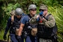 SANTA RITA, Guam (July 16, 2024)- Master-at-Arms 2nd Class Thomas Kilbourn (right) and Master-at-Arms Seaman Brinae Siegel, assigned to U.S. Naval Base Guam (NBG), escort medics assigned to Joint Region Marianas Fire and Emergency during an active shooter training, as a part of Citadel Pacific 2024, at the Sasa Valley Fuel Farm, July 16. Preparing military and security forces to respond during real-world incidents, the training involved the simulation of active shooters, injured bystanders, and hostages.