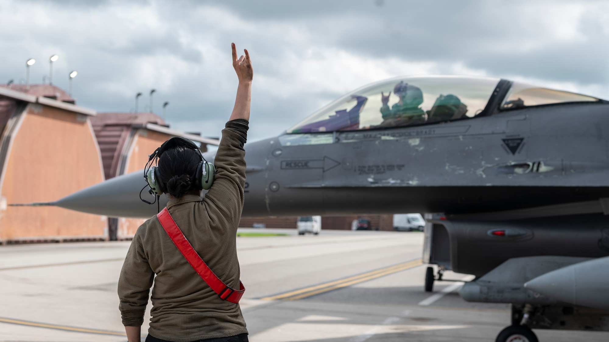 U.S. Air Force Airman Alexus Resendiz, 36th Fighter Generation Squadron crew chief, marshals an F-16 Fighting Falcon at Osan Air Base, Republic of Korea, July 24, 2024. In an air-to-surface role, the F-16 can fly more than 500 miles, deliver its weapons with superior accuracy, defend itself against enemy aircraft, and return to its starting point, making it a vital part of the “Fight Tonight” mission. (U.S. Air Force photo by Staff Sgt. Ashley N. Mikaio)