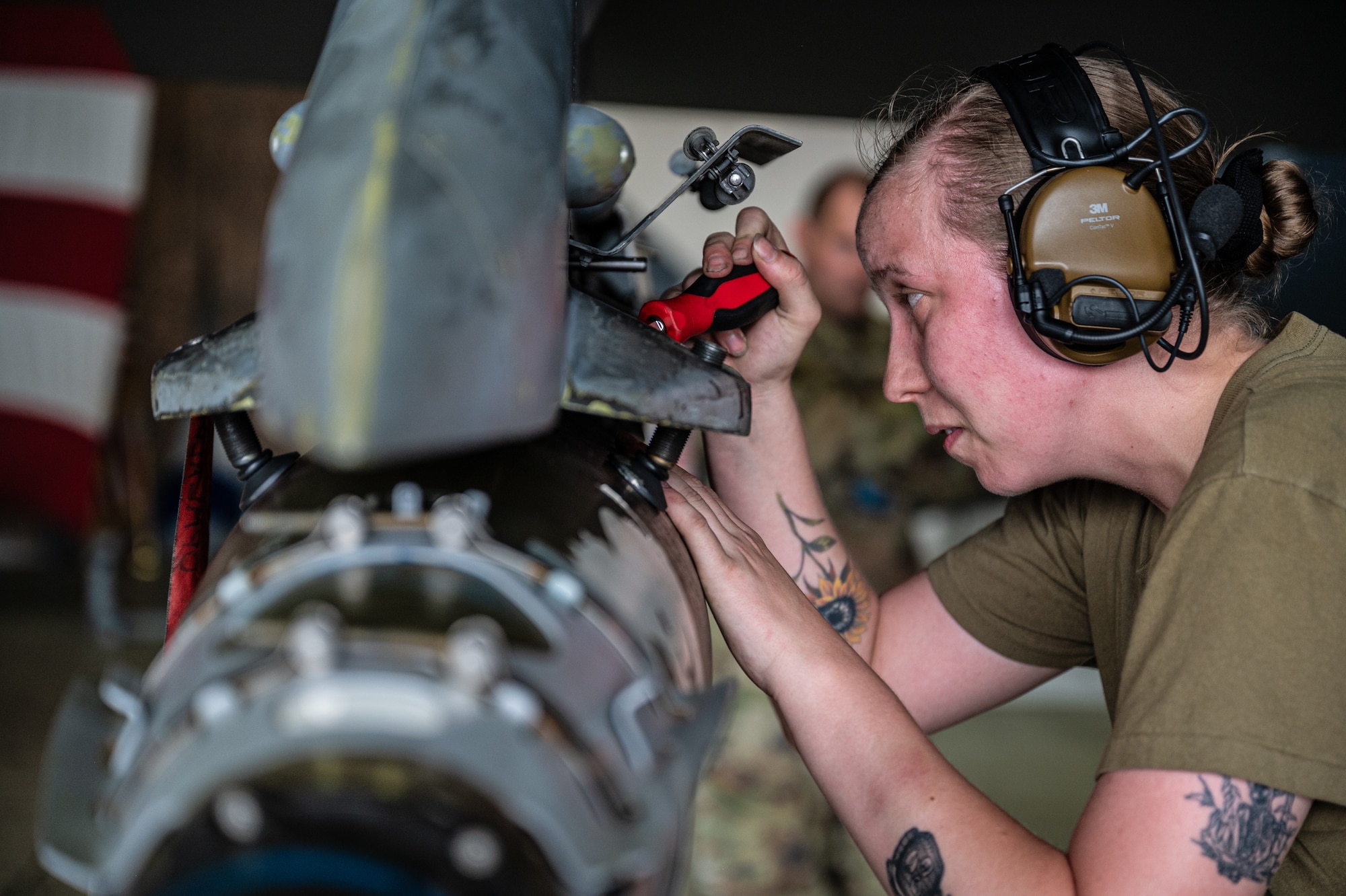 U.S. Air Force Senior Airman Erin Williamson, 36th Fighter Generation Squadron weapons load crew member, participates in the 2nd Quarter Load Crew Competition at Osan Air Base, Republic of Korea, July 26, 2024. Williamson was one of three members representing the 36th FGS team during the competition. The event consisted of building and loading weapons onto F-16 Fighting Falcon and A-10 Thunderbolt II aircrafts. (U.S. Air Force photo by Staff Sgt. Christopher Tam)