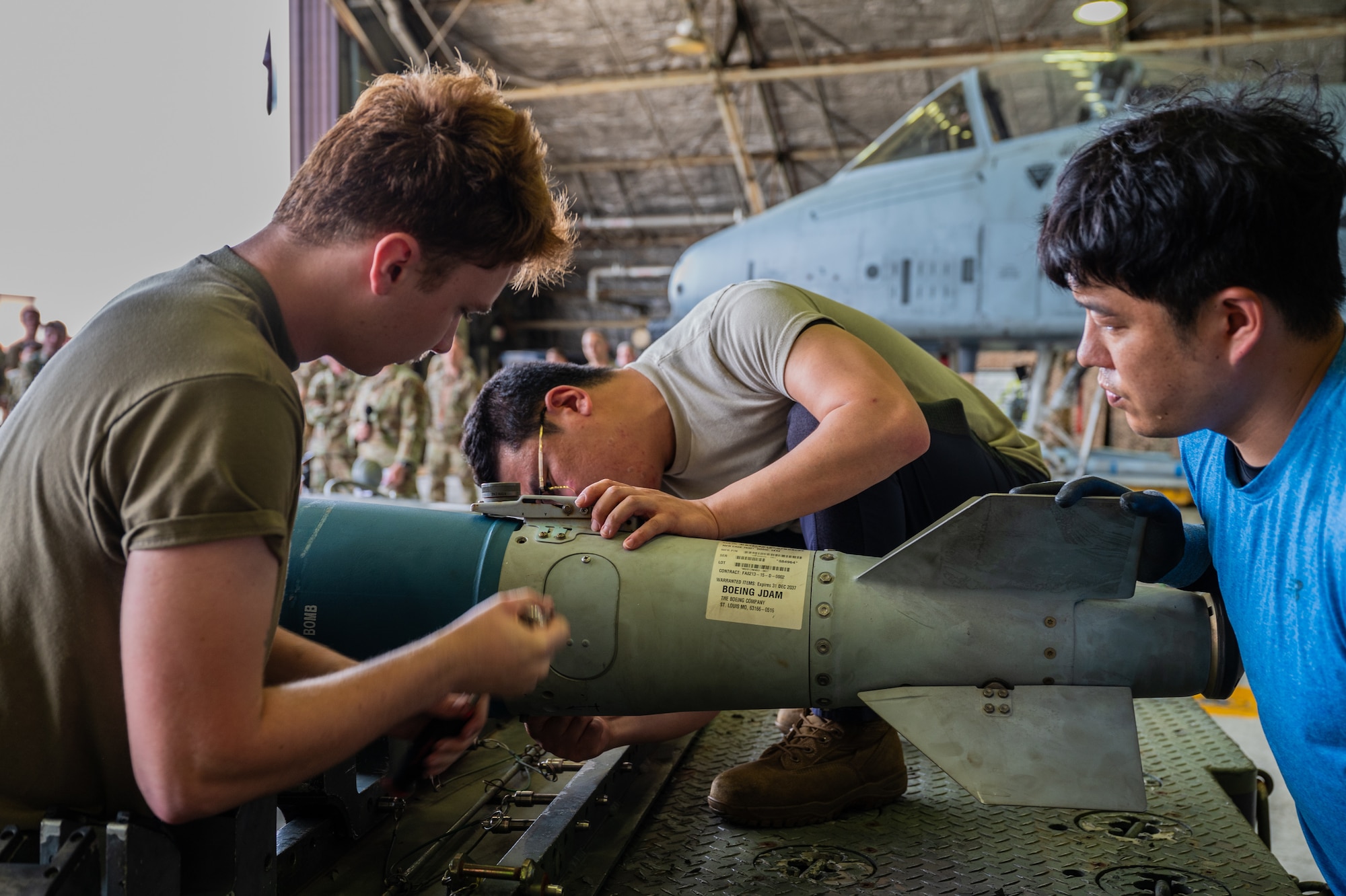 U.S. Air Force members assigned to the  51st Munitions Squadron participate in the 2nd Quarter Load Crew Competition at Osan Air Base, Republic of Korea, July 26, 2024. During the competition, conventional maintenance technicians are graded on their speed and technical accuracy, building competency and confidence in completing future mission requirements. (U.S. Air Force photo by Staff Sgt. Christopher Tam)