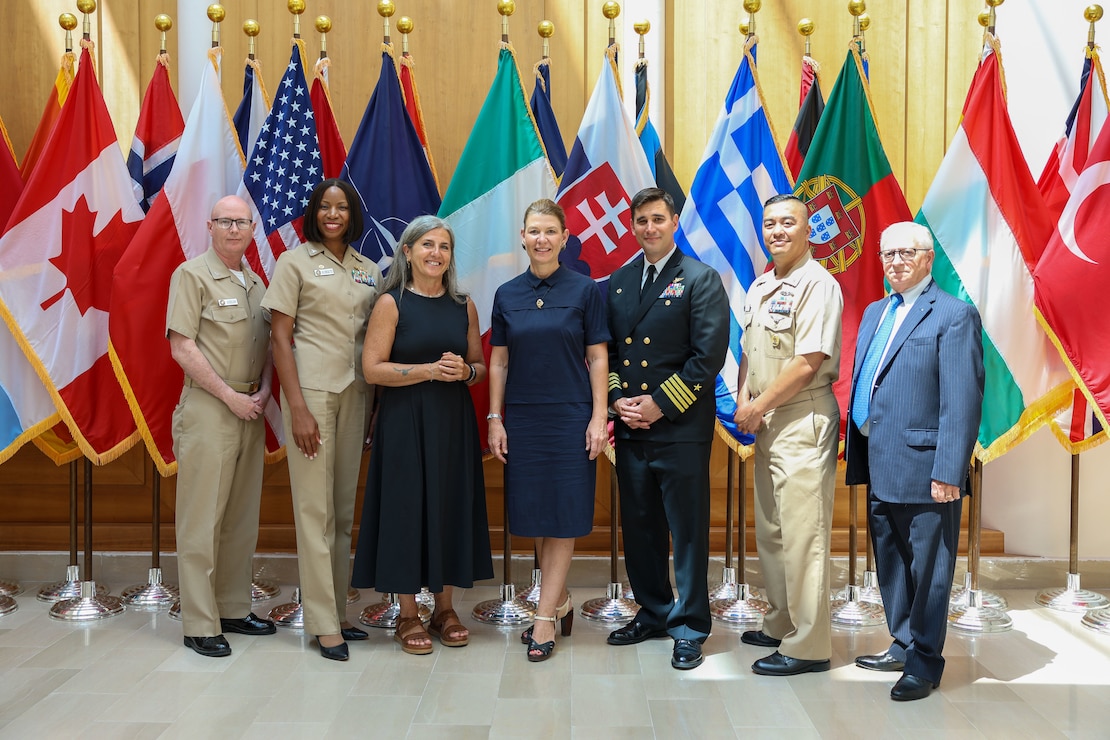 Capt. John Randazzo, commanding officer of Naval Support Activity (NSA) Naples, third from right, and Laura Lieto, Vice Mayor City of Naples, third from left, pose for a group photo during a tour of U.S. Naval Medical Readiness and Training Command (NMRTC) Naples, Italy, July 25, 2024. Also joining the tour (left to right) are Capt. Robert Anderson, executive officer of NMRTC Naples, Capt. Raynese Roberts, commander of NMRTC Naples, Tracy Roberts-Pounds, Consul General in Naples, and Raffaele (Ralph) Sgambato, Liaison Officer for the U.S. Hospital. NSA Naples is an operational ashore base that enables U.S., allied, and partner nation forces to be where they are needed, when they are needed to ensure security and stability in Europe, Africa, and Southwest Asia. (U.S. Navy photo by Mass Communication Specialist 2nd Class Alfredo Marron)