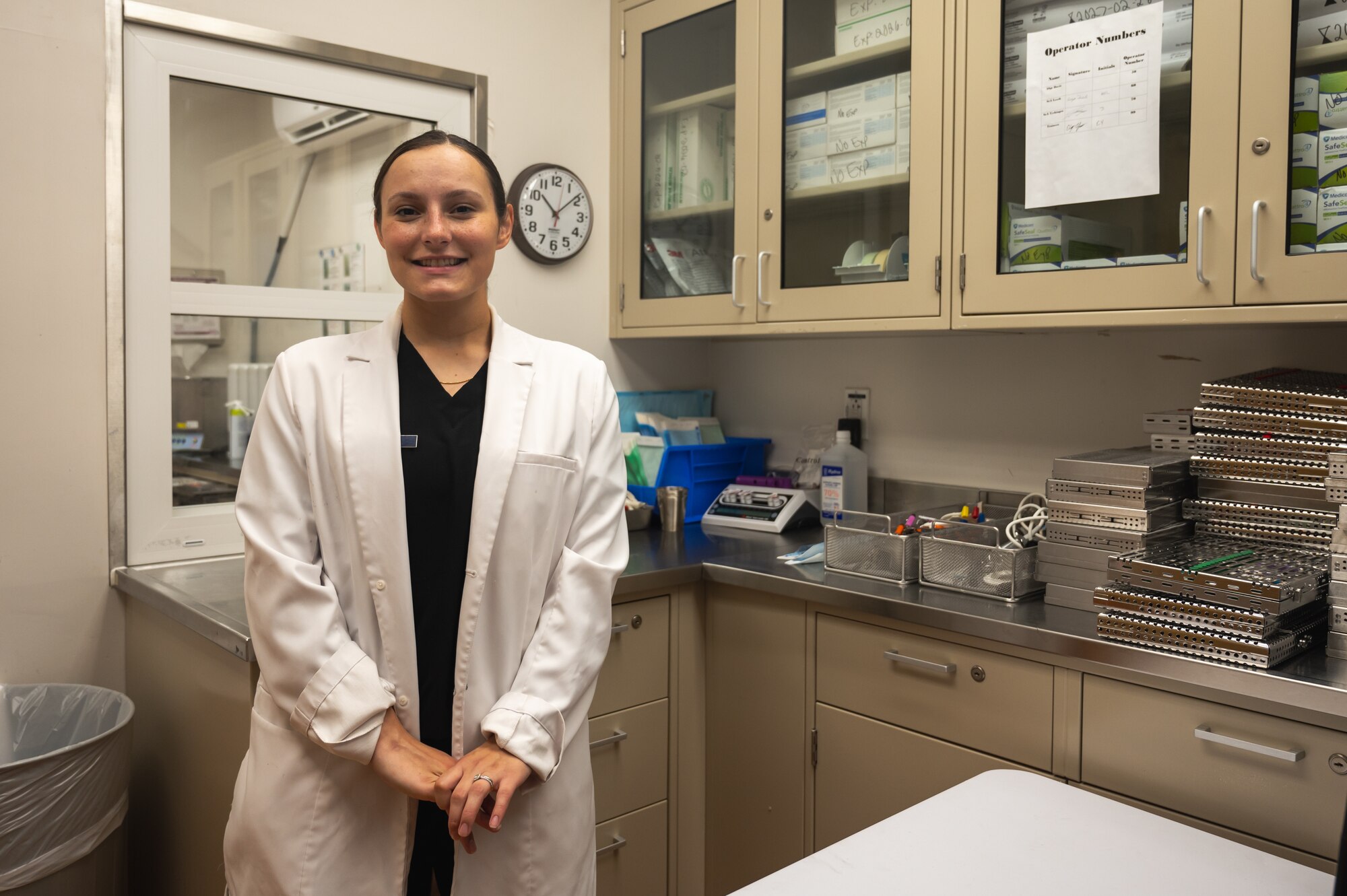 U.S. Air Force Staff Sgt. Kaycie Davis, 8th Operational Medical Readiness Squadron dental assistant, stands in a sanitation room.