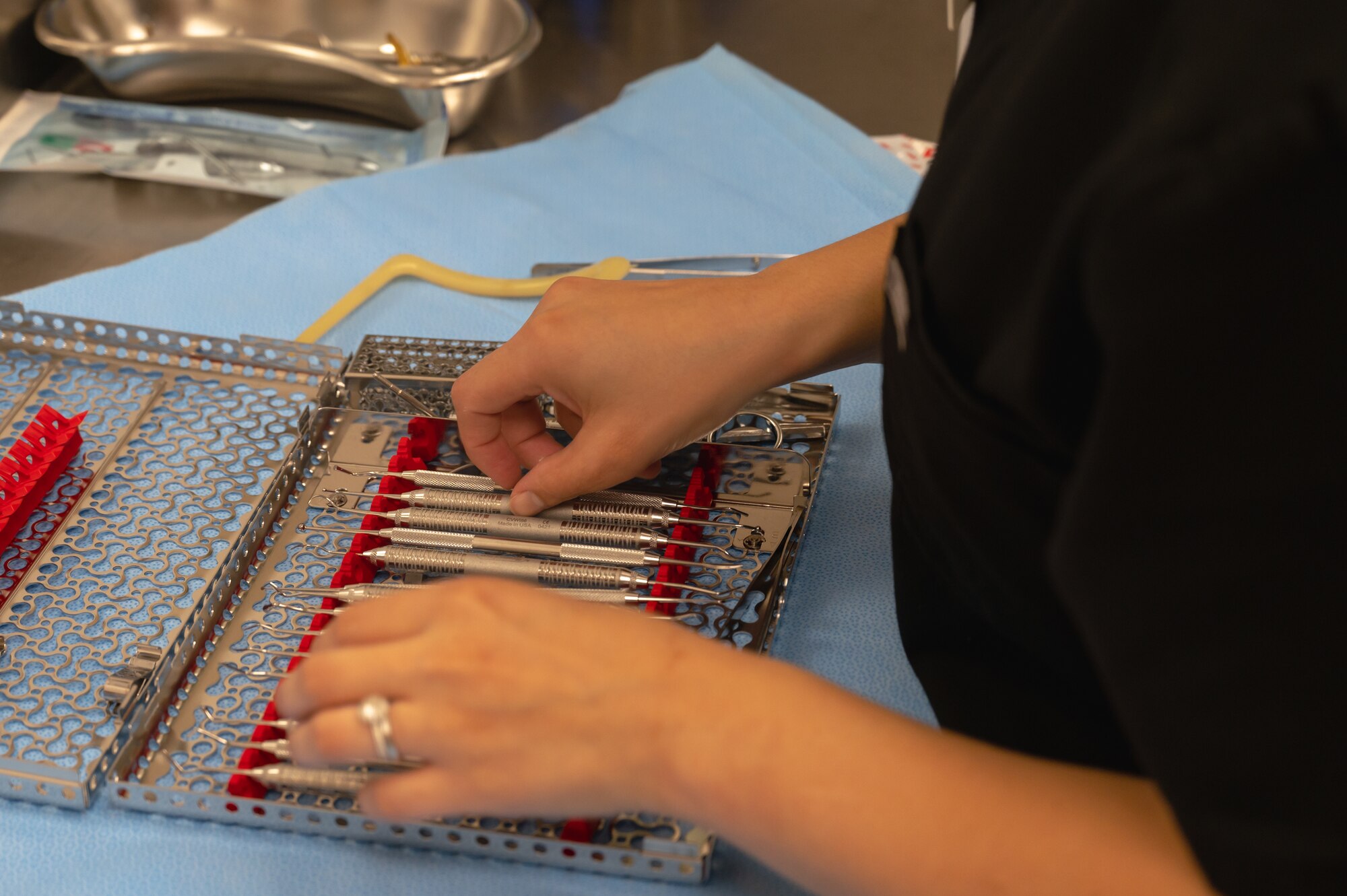 U.S. Air Force Staff Sgt. Kaycie Davis, 8th Operational Medical Readiness Squadron dental assistant, inspects a restoration kit