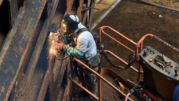 A welder from the U.S. Army Corps of Engineers Regional Rivers Repair Fleet welds one of the more than 40 cracks identified in the Old Hickory Lock chamber gates in Hendersonville, Tennessee, July 19, 2024. The water from the lock chamber is pumped out and repairs are made over the course of three weeks to ensure continued operability of the nearly 70-year-old lock. (USACE Photo by Braden Simmons)