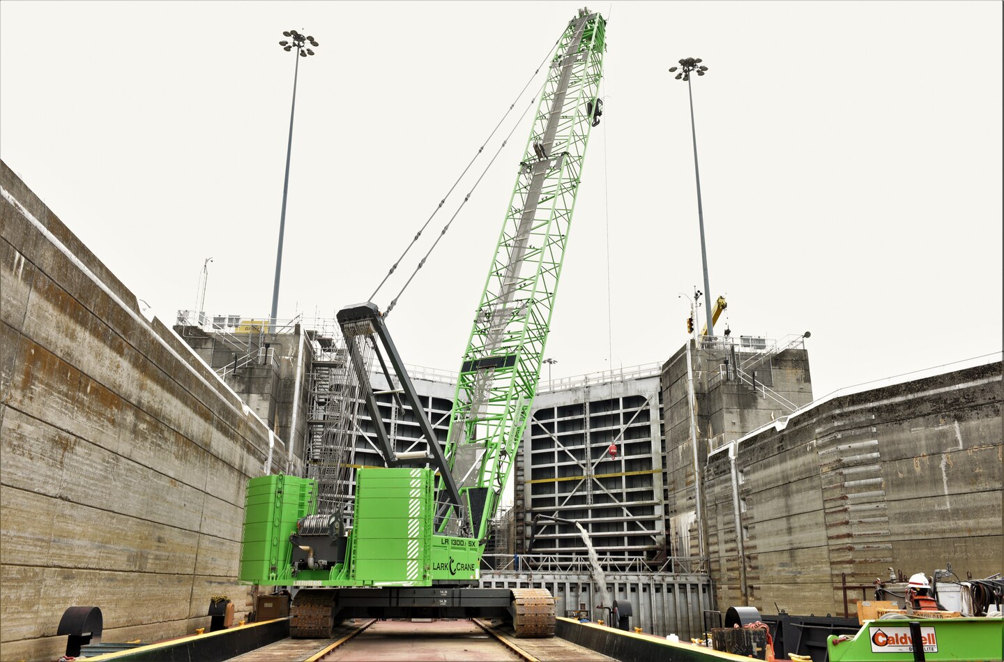 A U.S. Army Corps of Engineers Regional Rivers Repair Fleet crane provides additional materials to repair efforts while docked in front of Old Hickory Lock July 19, 2024. Old Hickory Lock is dewatered for scheduled maintenance and repair through Aug. 3, 2024. (USACE Photo by Braden Simmons)
