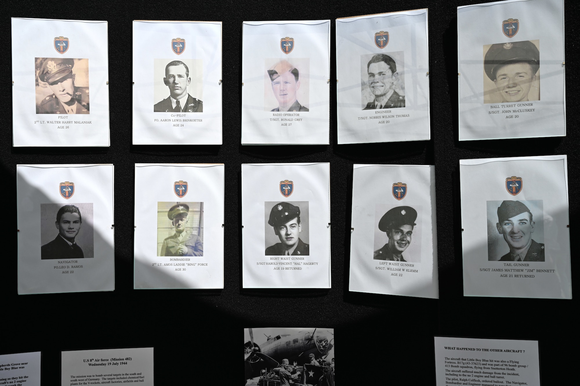 Photos of the U.S. Army Air Forces crew of the B-17 Flying Fortress “Little Boy Blue” are on display following a memorial ceremony near Bury St. Edmunds, Suffolk, England, July 19, 2024. The plane crashed during World War II, July 19, 1944, in a farmer’s field, killing almost all its crew – only two survived. Families of all the crew members attended the ceremony and unveiling of the memorial, along with Airmen from Royal Air Force Mildenhall, who laid a wreath to honor the Airmen who perished. (U.S. Air Force photo by Karen Abeyasekere)