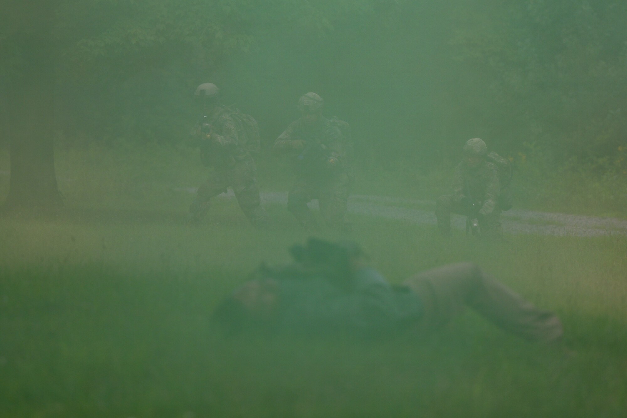 Integrated Defense Leadership Course students move on opposing force members during an area security operations exercise at Camp James A. Garfield Joint Military Training Center, Ohio, July 25, 2024.