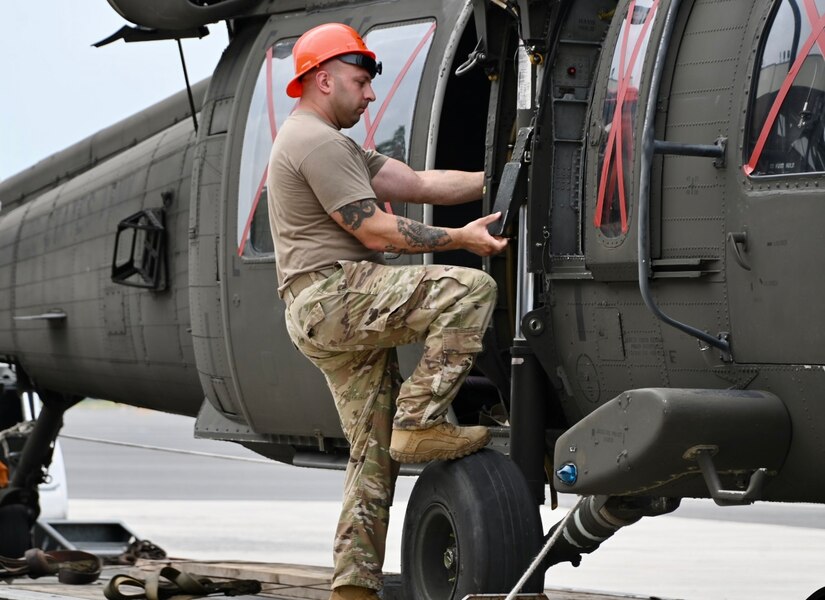 U.S. Soldiers with the Pennsylvania National Guard move a UH-60 Black Hawk helicopter onto a flatbed truck at Fort Indiantown Gap, Pennsylvania, July 24, 2024.