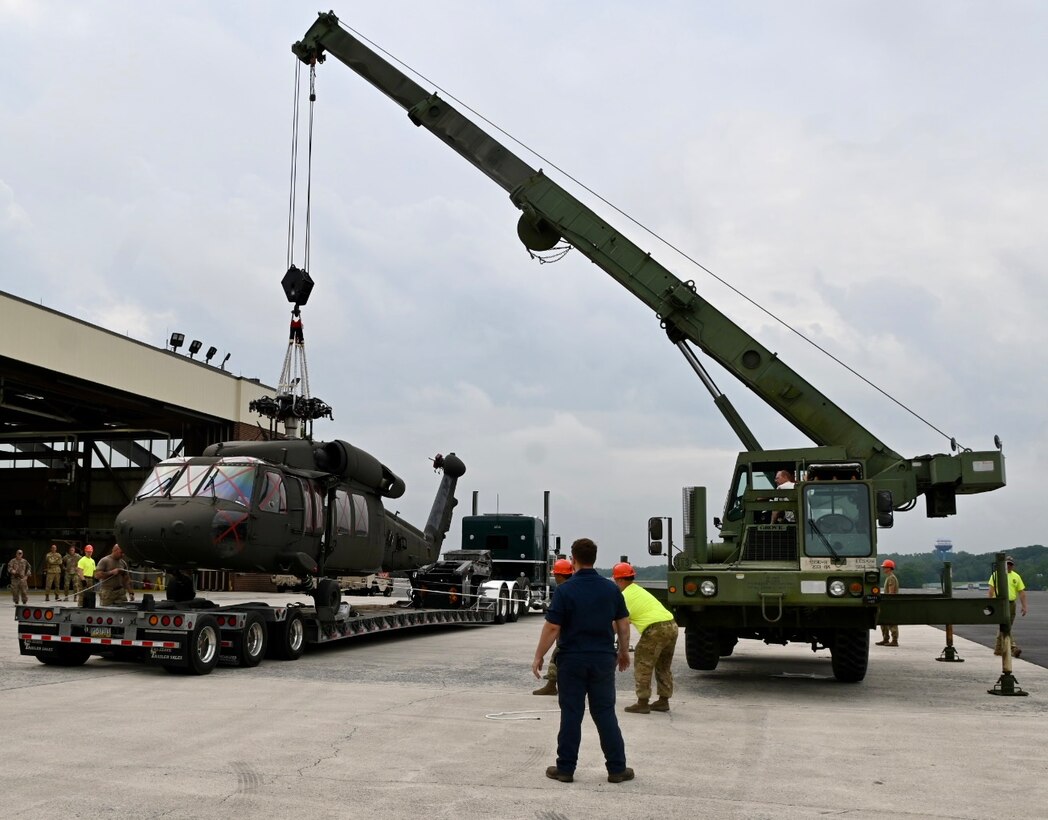 U.S. Soldiers with the Pennsylvania National Guard move a UH-60 Black Hawk helicopter onto a flatbed truck at Fort Indiantown Gap, Pennsylvania, July 24, 2024.