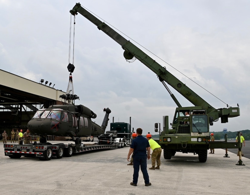 U.S. Soldiers with the Pennsylvania National Guard move a UH-60 Black Hawk helicopter onto a flatbed truck at Fort Indiantown Gap, Pennsylvania, July 24, 2024.