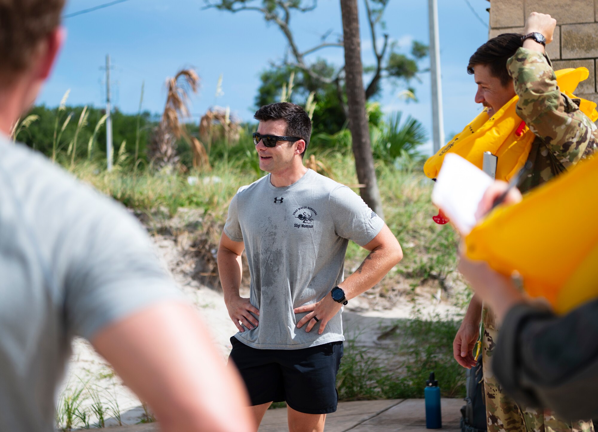 U.S. Air Force Staff Sgt. Matthew Montour, a Survival, Evasion, Resistance and Escape specialist assigned to the 6th Operations Support Squadron, briefs aircrew members on water survival tactics at MacDill Air Force Base, Florida, June, 28, 2024. Air Force pilots and other aircrew members are required to enroll in SERE courses to prepare them for in-flight emergencies. (U.S. Air Force photo by Airman 1st Class Alicia Campbell)