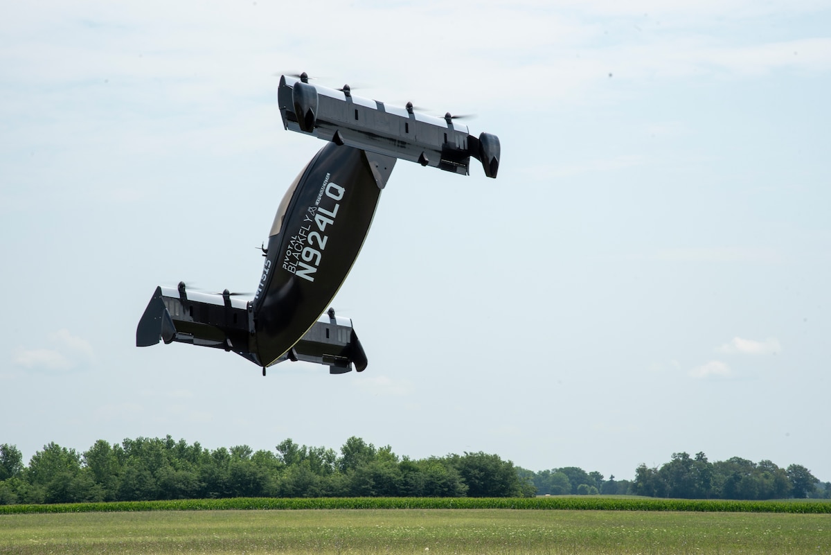 AFWERX, the Department of the Air Force’s innovation arm within the Air Force Research Laboratory, and Beavercreek, Ohio-based defense contractor Modern Technology Solutions Inc. evaluate Pivotal’s BlackFly electric vertical take-off and landing aircraft at Springfield-Beckley Airport, Ohio, July 12, 2024.