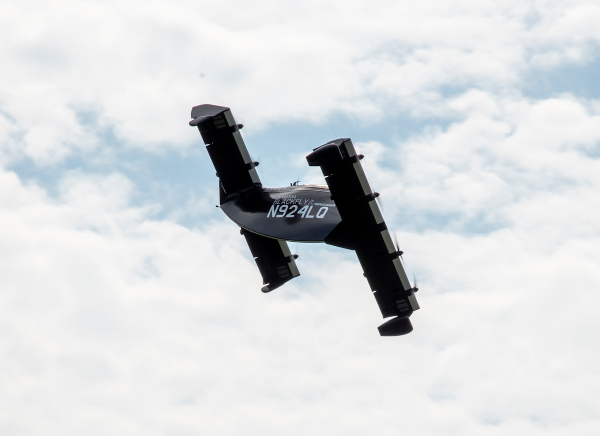 AFWERX, the Department of the Air Force’s innovation arm within the Air Force Research Laboratory, and Beavercreek, Ohio-based defense contractor Modern Technology Solutions Inc. evaluate Pivotal’s BlackFly electric vertical take-off and landing aircraft at Springfield-Beckley Airport, Ohio, July 12, 2024.