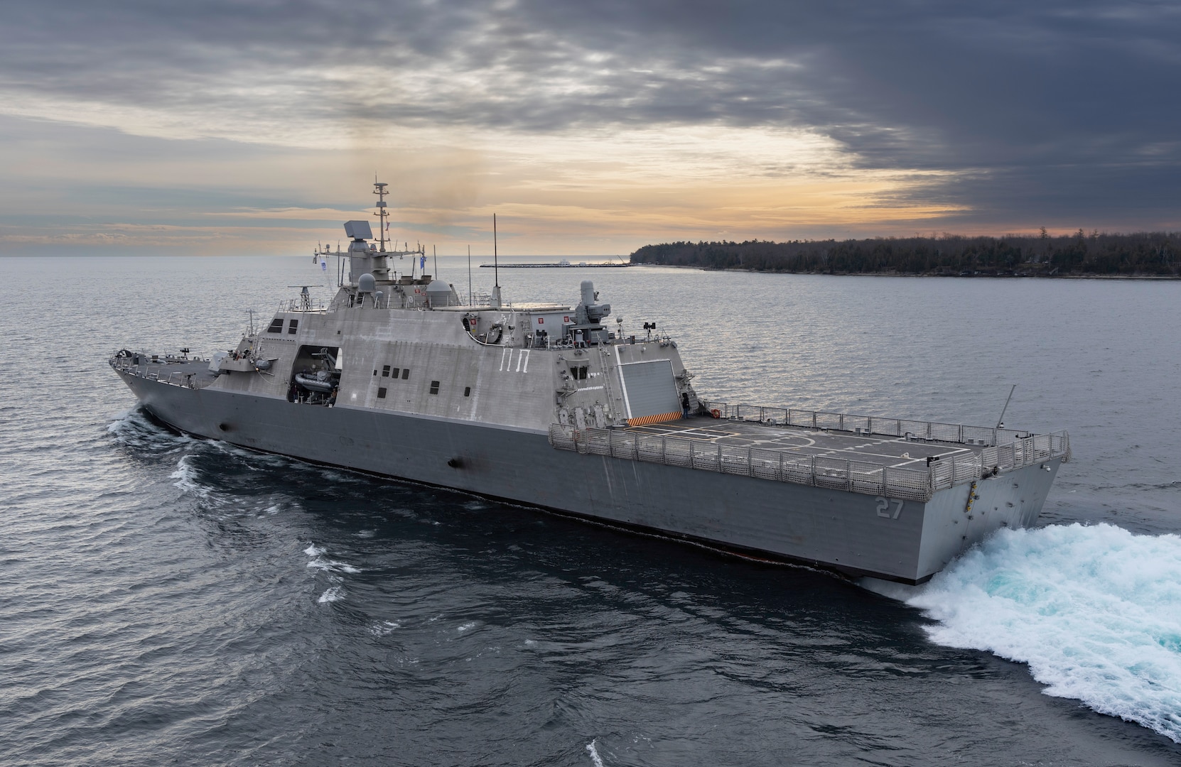 The future USS Nantucket transits the Menominee River in northern Wisconsin, departing for at-sea demonstrations during Acceptance Trials, December 6, 2023.