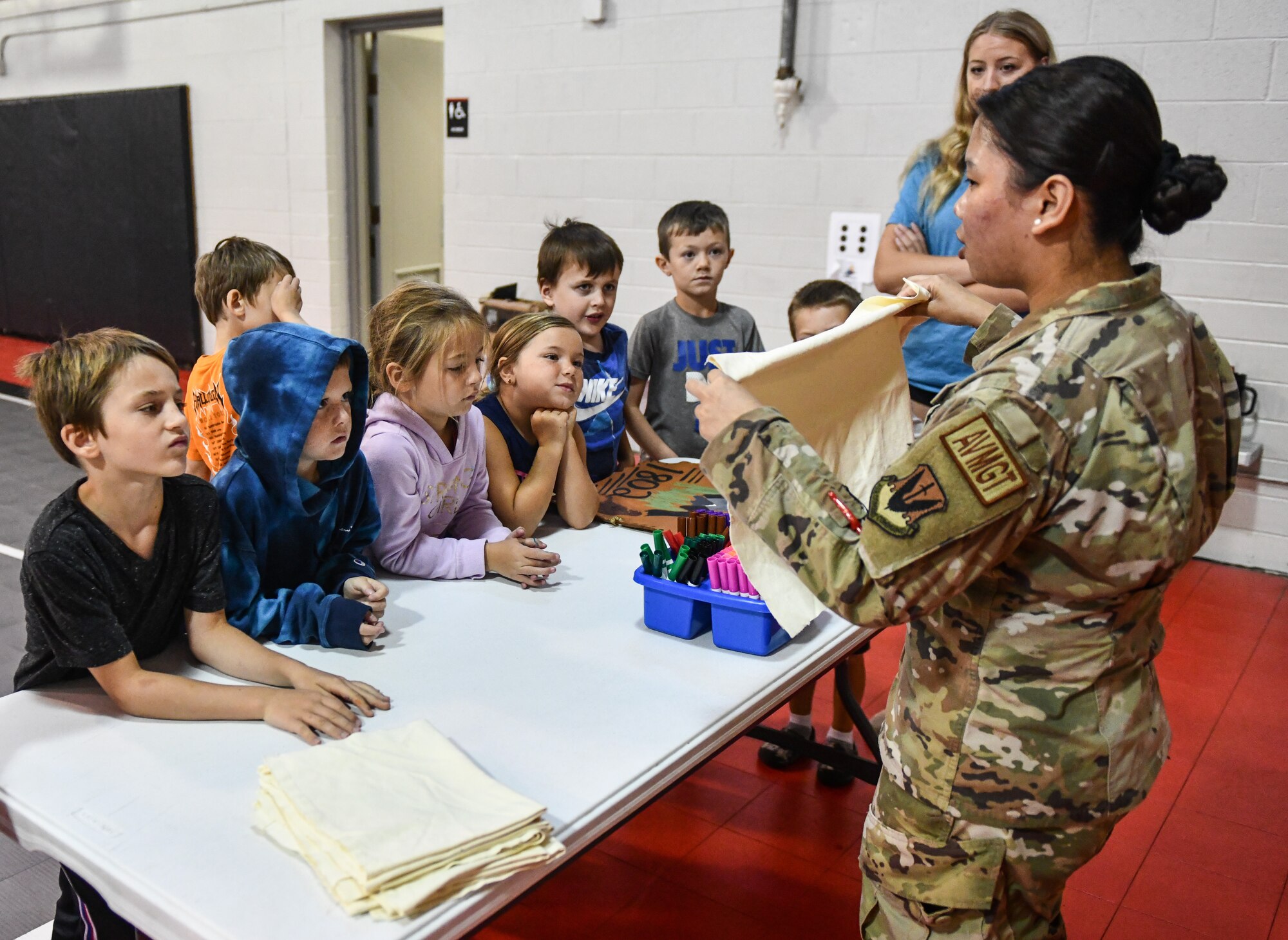 children get instruction on banner making