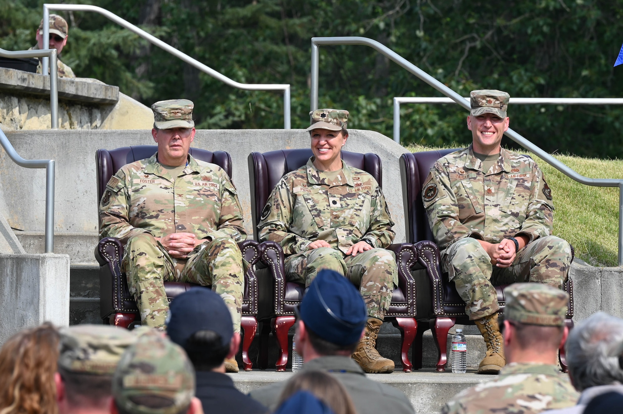 U.S. Air Force Col. Timothy Foster (left), 354th Mission Support Group commander, Lt. Col. Dawn Pieper (middle), 354th Logistics Readiness Squadron outgoing commander, and Maj. Peter Daigle, 354th LRS incoming commander, prepare for the start of the 354th LRS change of command ceremony at Eielson Air Force Base, Alaska, July 24, 2024.