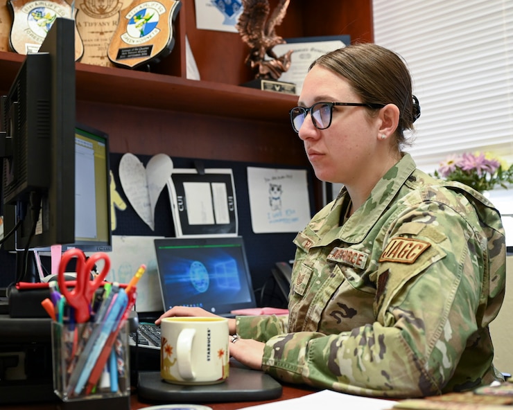 Tech. Sgt. Tiffany Raines, 355th Wing Legal Office non-commissioned officer in charge of adverse action, works on her computer at Davis-Monthan A ir Force Base, Ariz., April 5, 2023. Adverse action is one of the many areas in which the legal office provides assistance. (U.S. Air Force photo by Airman William Finn)