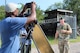 Soldier getting interviewed by film crew outside perimeter of a simulated Forward Operating Base