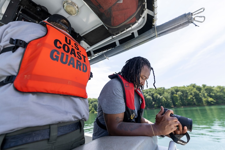 Andre’ Hampton, a U.S. Army Corps of Engineers public affairs specialist for the Buffalo District, records video of Summersville Lake during a regional visual storytelling workshop in Summersville, West Virginia, June 26, 2024.
