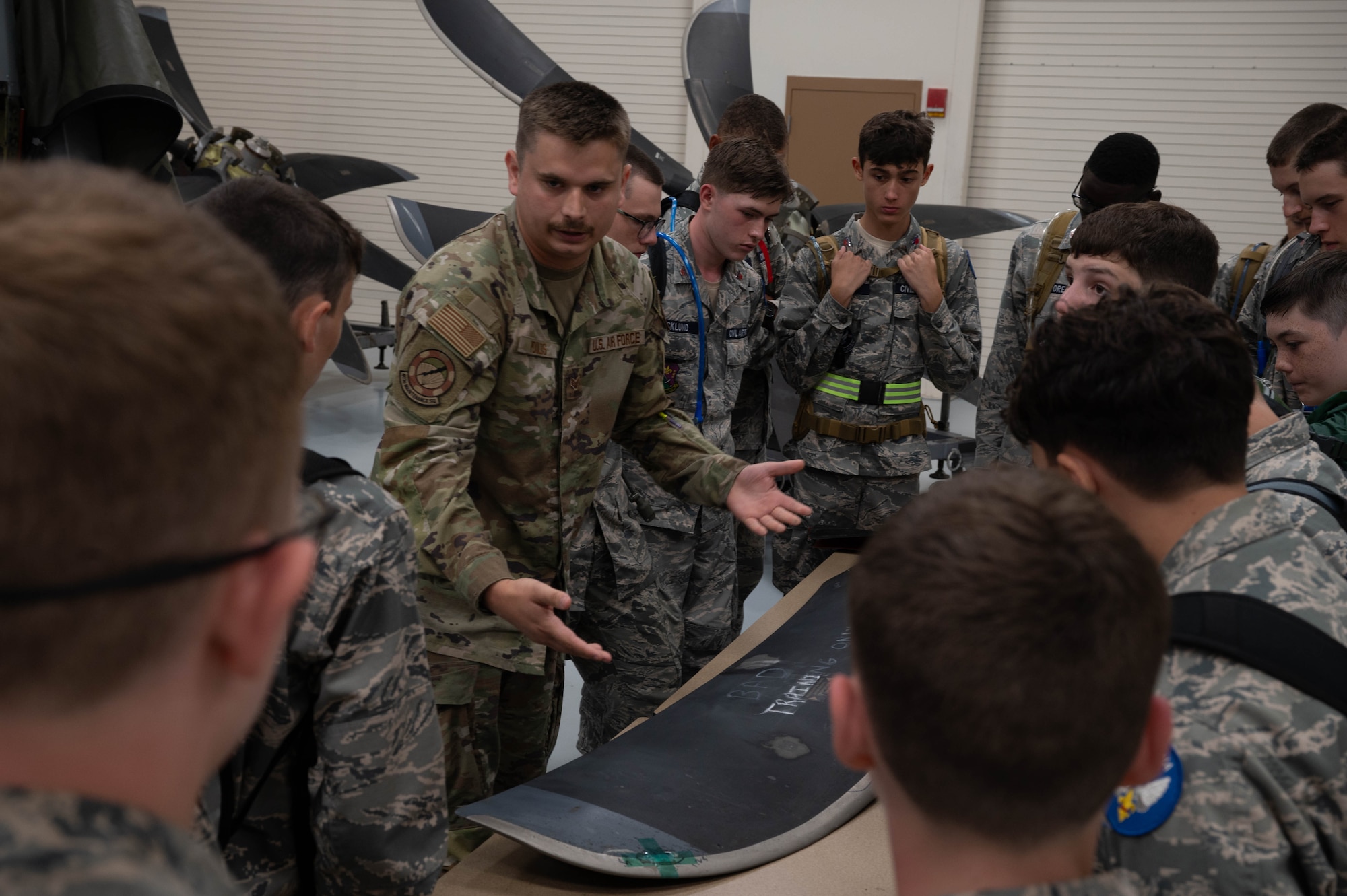 Guy explaining wing mission to civil air patrol cadets.