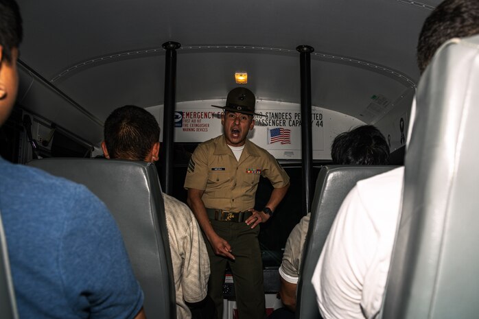 U.S. Marine Corps Sgt. Emmanuel Medina, a drill instructor with Receiving Company, Support Battalion, briefs recruits of Echo Company, 2nd Recruit Training Battalion, during a receiving event at Marine Corps Recruit Depot San Diego, California, July 22, 2024. During the receiving process, recruits are checked for contraband, given haircuts, make a scripted phone call home, and issued gear required for training. (U.S. Marine Corps photo by Cpl. Sarah M. Grawcock)