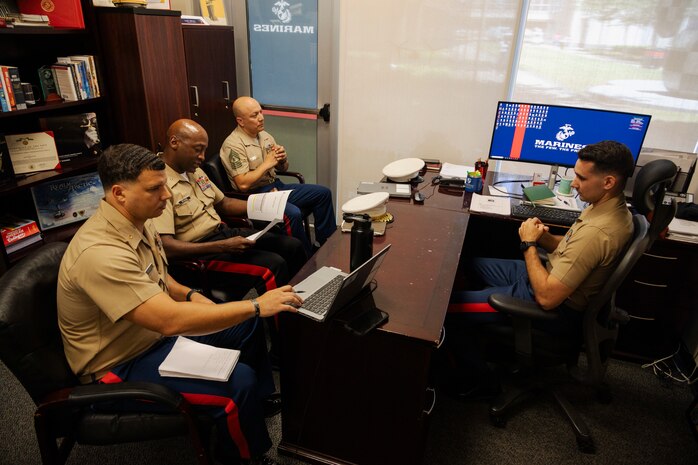 From left, U.S. Marine Corps Maj. Jordan Eddington, the commanding officer of Recruiting Station Houston; Brig. Gen. James A. Ryans, the Western Recruiting Region commanding general; Master Gunnery Sgt. Gerardo Ortiz, the recruiting instructor for RS Houston; and Capt. Joe Aiello, the officer selection officer for RS Houston; speak to each other at the University of Houston campus in Houston, Texas, July 30, 2024. Ryans visited the RS to discuss the RS Officer Selection Team's performance and trends in the officer candidate process. (U.S. Marine Corps photo by Sgt. Ryan H. Pulliam)