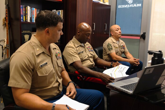 From left, U.S. Marine Corps Maj.  Jordan Eddington, the commanding officer of Recruiting Station Houston; Brig. Gen. James A. Ryans, the Western Recruiting Region commanding general; and Master Gunnery Sgt. Gerardo Ortiz, the recruiting instructor for RS Houston; discuss on the RS Houston Officer Selection Team the University of Houston campus in Houston, Texas, July 30, 2024. Ryans visited the RS to discuss the OST's performance and trends in the officer candidate process. (U.S. Marine Corps photo by Sgt. Ryan H. Pulliam)