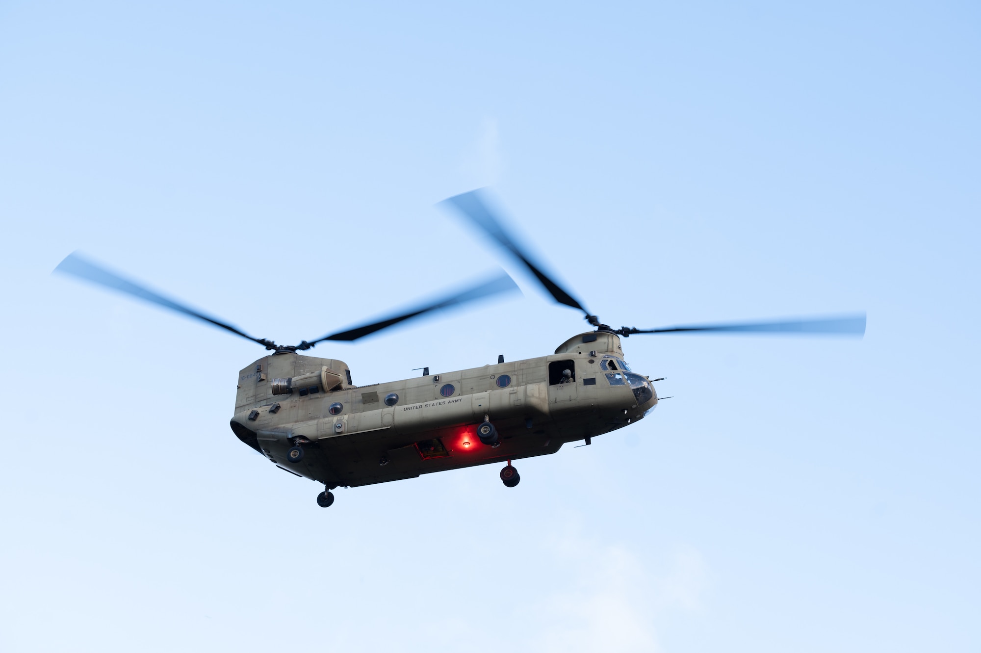 A chinook flies in the sky.