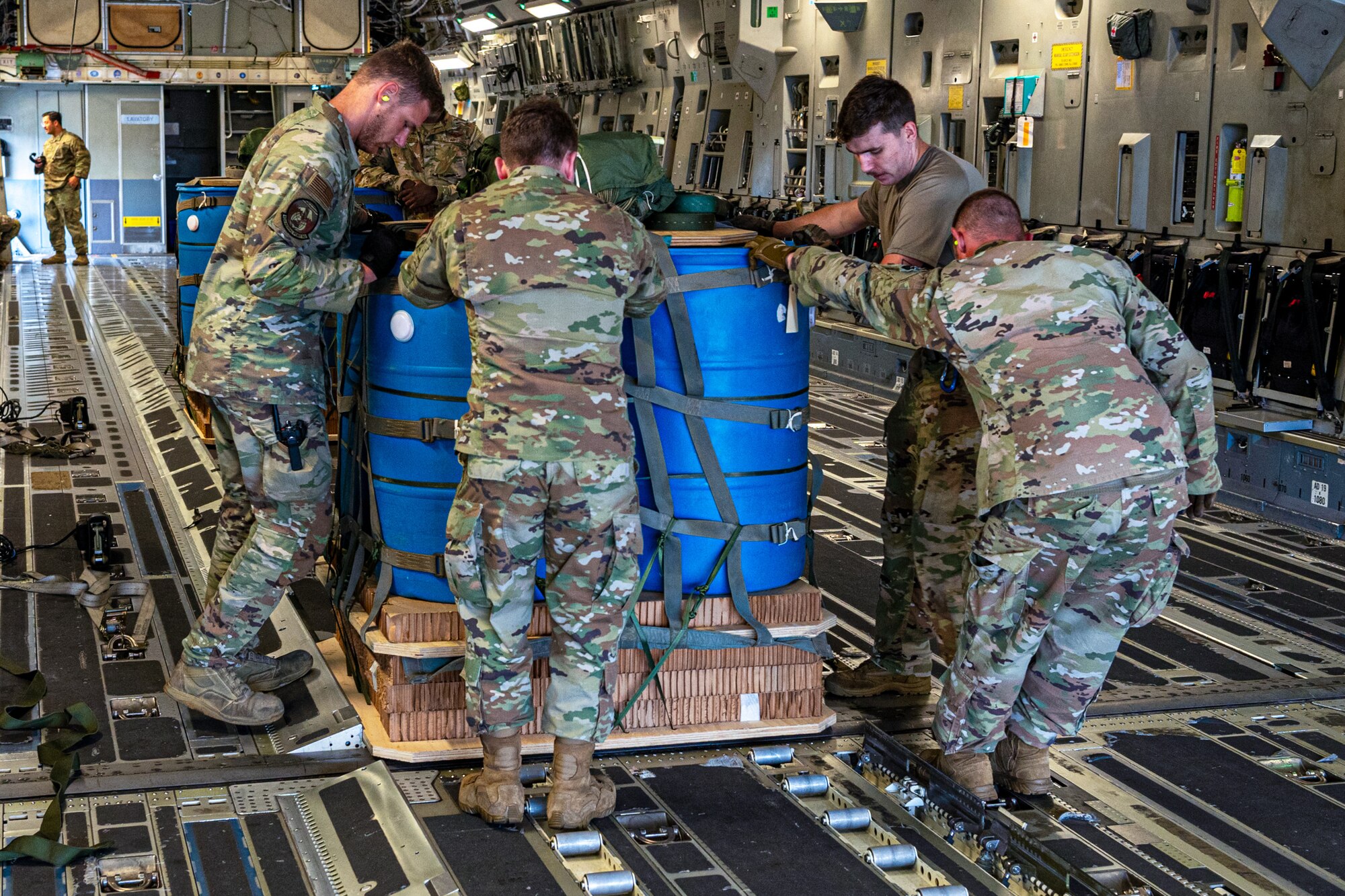 Airmen assigned to the 62d Airlift Wing load an airdrop pallet onto a C-17 Globemaster III at Joint Base Lewis-McChord, Washington, July 30, 2024. The C-17 is a high-wing, four-engine, T-tailed military transport vehicle capable of carrying payloads up to 169,000 pounds. (U.S. Air Force photo by Airman 1st Class Benjamin Riddle)