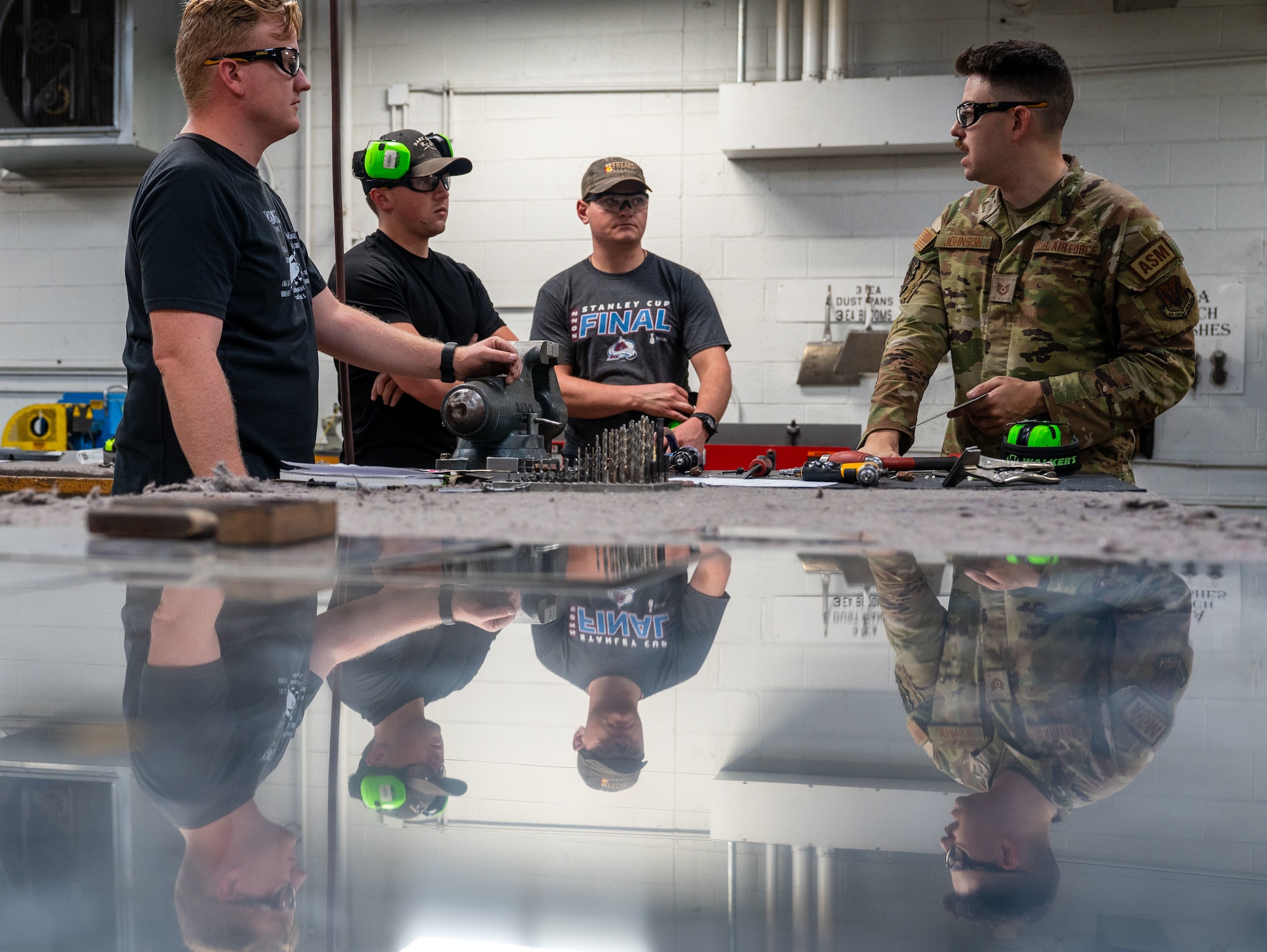 U.S. Airmen assigned to the 55th Electronic
Combat Group and 355th Aircraft
Maintenance Squadron learn techniques for
drilling sheet metal at Davis-Monthan Air
Force Base, Ariz., July 17, 2024. The Airmen
were participating in a course that taught
them all aspects of aircraft maintenance.
(U.S. Air Force photo by Airman 1st Class
Jasmyne Bridgers-Matos)
