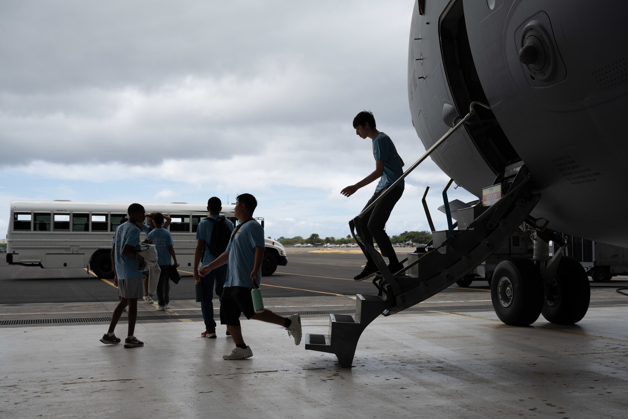 Students exit an aircraft.