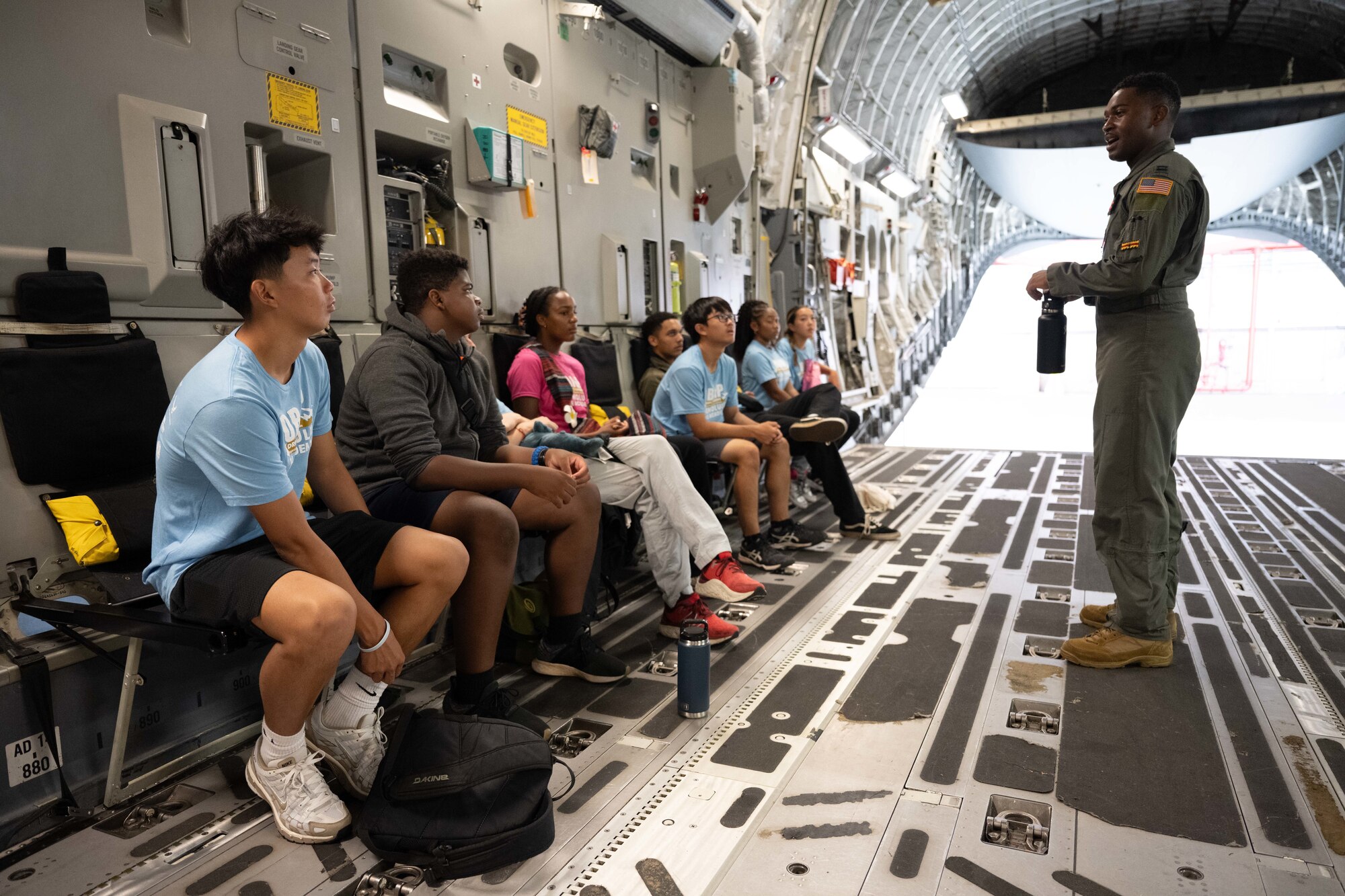 Students sit in an aircraft.