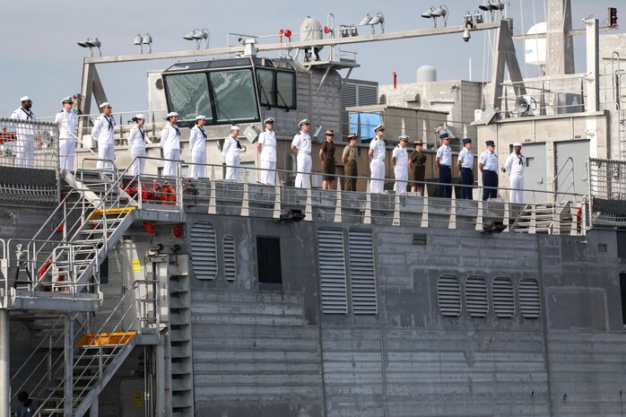 LEGAZPI, Philippines (July 30, 2024) – U.S. Navy Sailors, U.S. Army Soldiers, members of the Australian Defense Force and members of the British Armed Forces, man the rails as the expeditionary fast transport ship USNS City of Bismarck (T-EPF 9) sails into the Port of Legazpi in preparation for the start of Pacific Partnership 24-2 in the Philippines July 30, 2024. Now in its 20th iteration, Pacific Partnership series is the largest annual multinational humanitarian assistance and disaster relief preparedness mission conducted in the Indo-Pacific. Pacific Partnership works collaboratively with host and partner nations to enhance regional interoperability and disaster response capabilities, increase security and stability in the region, and foster new and enduring friendships in the Indo-Pacific. (U.S. Navy photo by Mass Communication Specialist 1st Class Ryan D. McLearnon/Released)