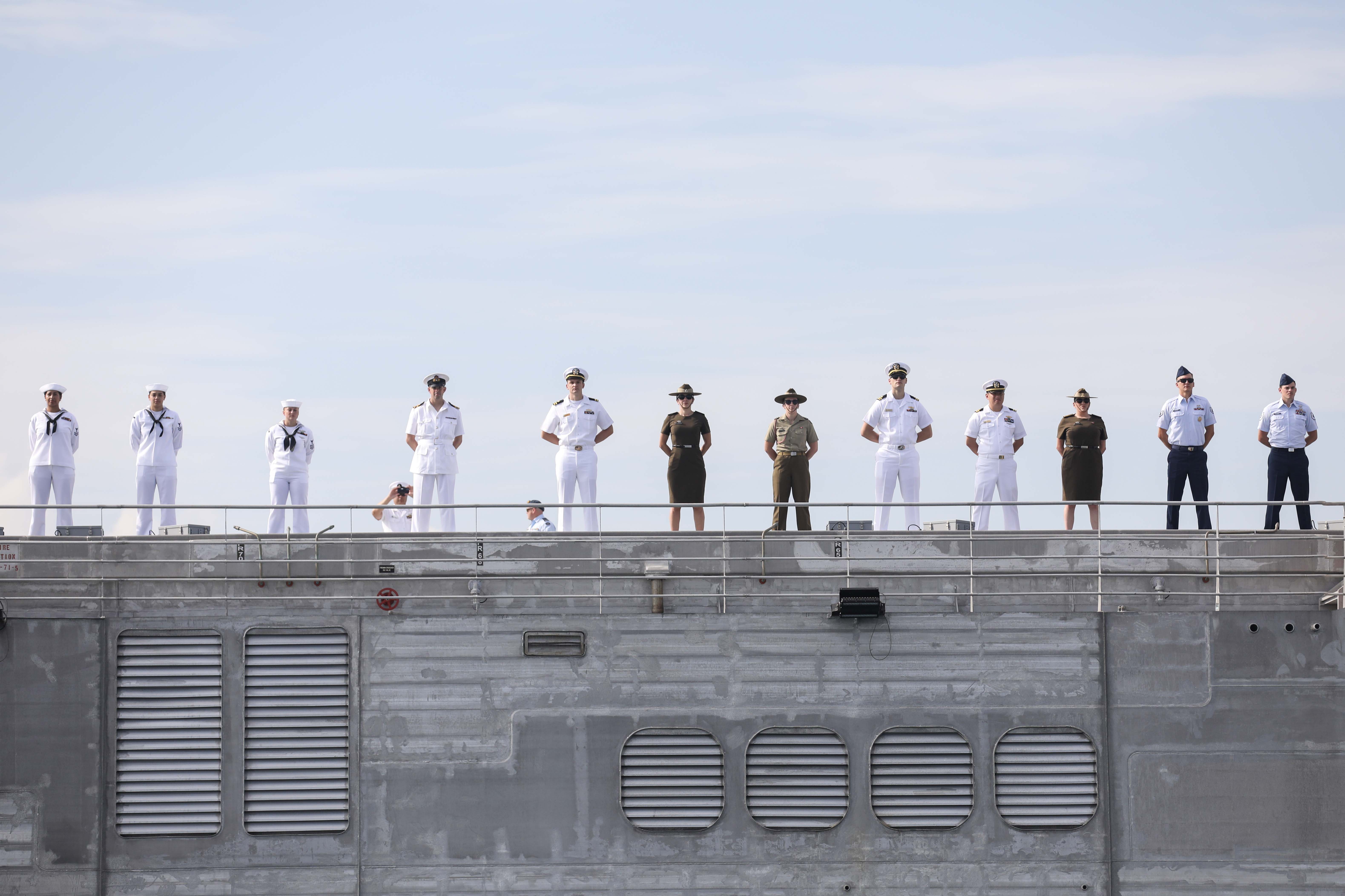 LEGAZPI, Philippines (July 30, 2024) – U.S. Navy Sailors, U.S. Army Soldiers, members of the Australian Defense Force and members of the British Armed Forces, man the rails as the expeditionary fast transport ship USNS City of Bismarck (T-EPF 9) sails into the Port of Legazpi in preparation for the start of Pacific Partnership 24-2 in the Philippines July 30, 2024. Now in its 20th iteration, Pacific Partnership series is the largest annual multinational humanitarian assistance and disaster relief preparedness mission conducted in the Indo-Pacific. Pacific Partnership works collaboratively with host and partner nations to enhance regional interoperability and disaster response capabilities, increase security and stability in the region, and foster new and enduring friendships in the Indo-Pacific. (U.S. Navy photo by Mass Communication Specialist 1st Class Ryan D. McLearnon/Released)