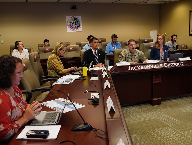 Col. Brandon Bowman, U.S. Army Corps of Engineers Jacksonville District commander, talks with his Jacksonville Puerto Rico Coastal Risk Management study team while communicating with personnel from the U.S. Army Corps of Engineers, Headquarters via Microsoft Teams to work on details of the Chief’s Report for the Puerto Rico Coastal Storm Risk Management Study July 30, 2026.
The study evaluates damages from hurricanes and coastal storms to determine the Federal interest in a plan to reduce damages to structures, property and critical infrastructure, recreational and beach areas as a result of erosion, wave attack, and flooding.(USACE photo by Mark Rankin)