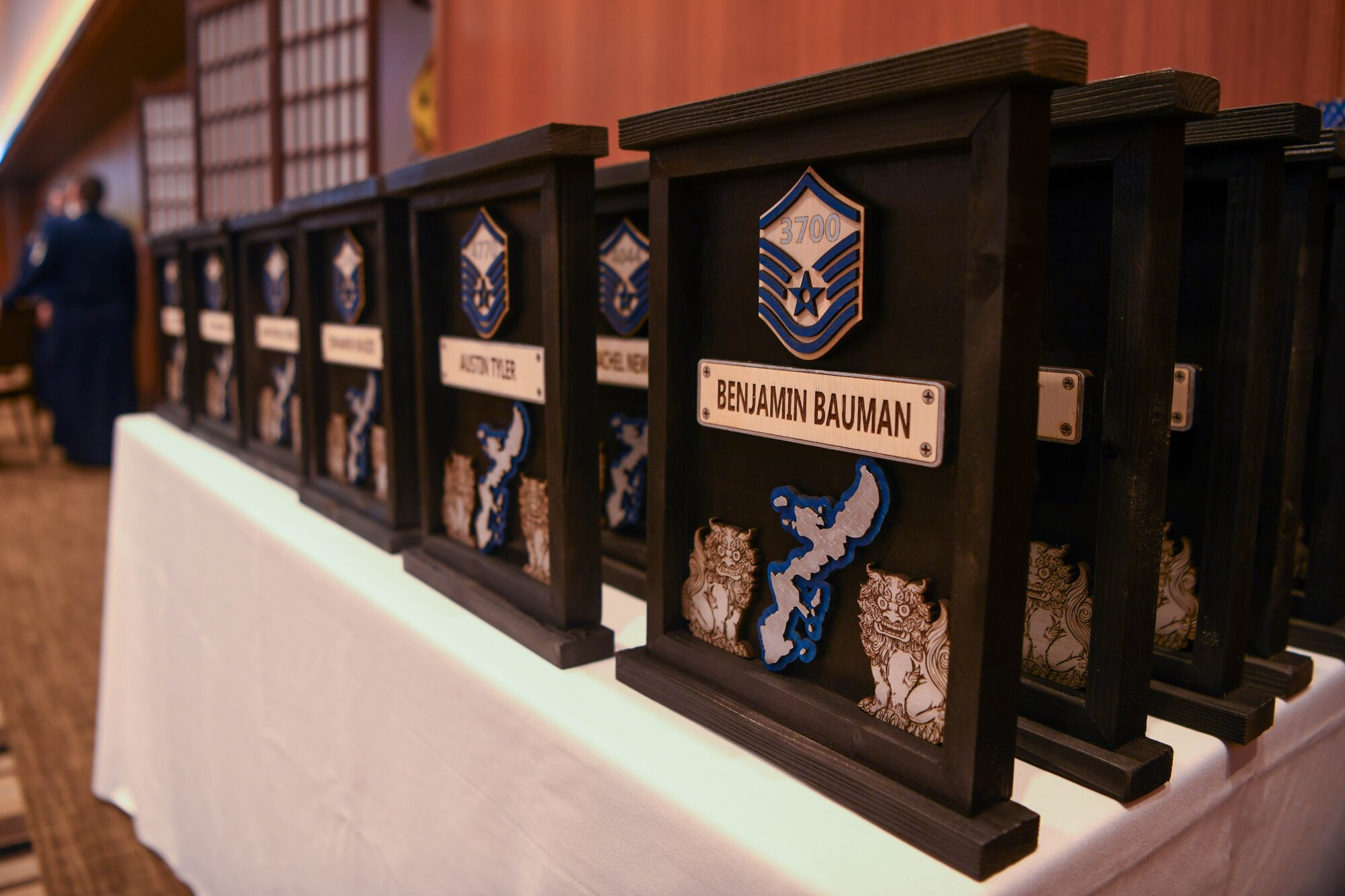 Plaques displaying names of SNCO inductees.
